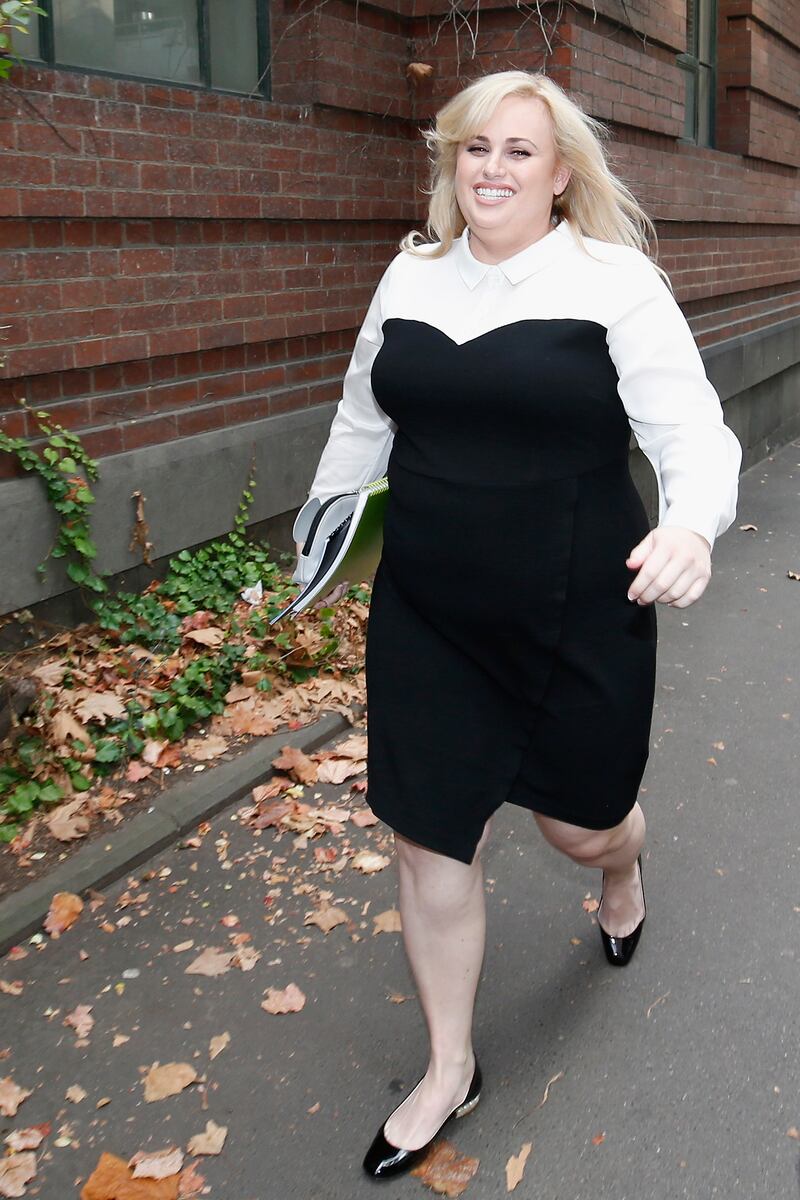 Rebel Wilson, wearing a white shirt with a black dress, walks into court in Melbourne on June 15, 2017. Getty Images 