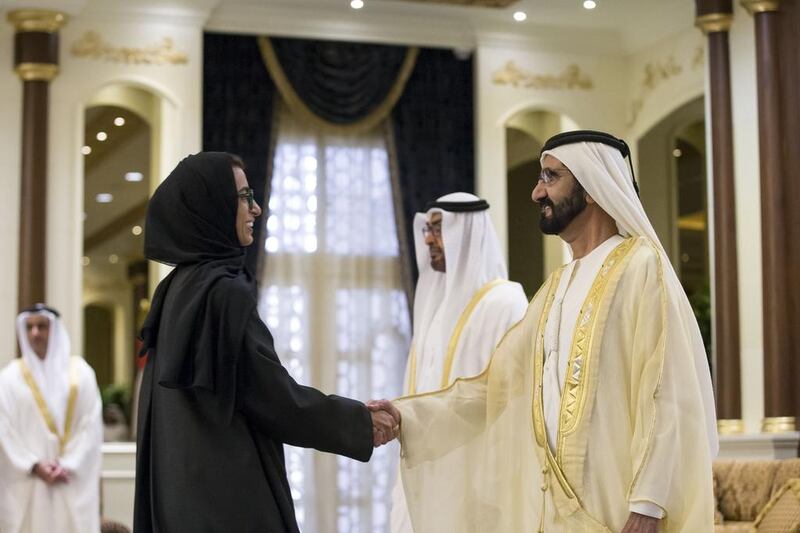 Sheikh Mohammed bin Rashid, Vice-President and Ruler of Dubai, greets Noura Al Kaabi, Minister of State for FNC Affairs, during a swearing-in ceremony for the Cabinet ministers.