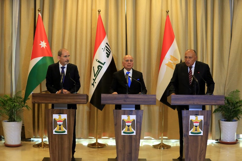 Iraqi Foreign Minister Fuad Hussein, centre, Egyptian Foreign Minister Sameh Shoukry, right, and Jordanian Foreign Minister Ayman Safadi in Baghdad, Iraq. EPA