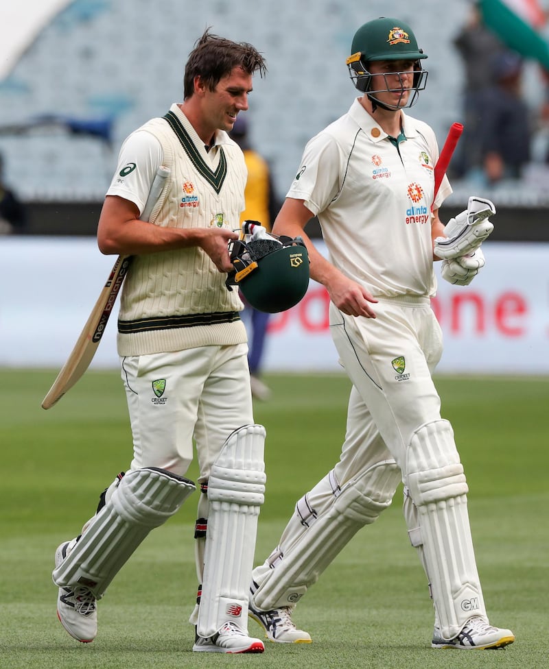 Australian not out batsmen Pat Cummins, left, and teammate Cameron Green. AP