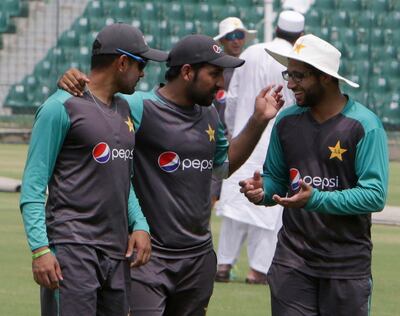 Sarafraz Ahmed, center, captain of Pakistani cricket team briefs players during the team practice session in Lahore, Pakistan, Tuesday, Sept. 4, 2018. Ehsan Mani was officially elected unopposed as the chairman of Pakistan Cricket Board on Tuesday. Prime minister Imran Khan, who is also patron of the PCB, nominated Mani as the member of the Board of Governors last month after Najam Sethi resigned as the PCB chairman. (AP Photo/K.M. Chaudary)