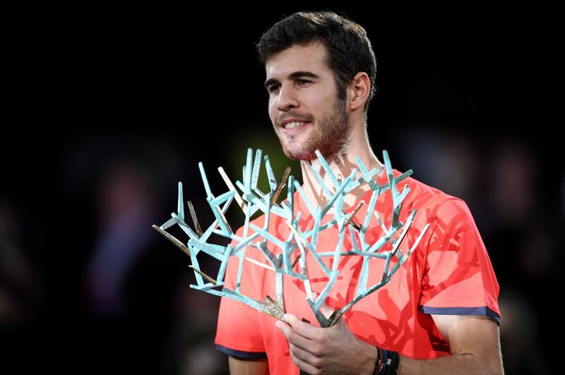 Russia's Karen Khachanov poses with the trophy after winning against Serbia's Novak Djokovic, the men's singles final tennis match on day seven of the ATP World Tour Masters 1000 - Rolex Paris Masters - indoor tennis tournament at The AccorHotels Arena in Paris, on November 4, 2018. / AFP / CHRISTOPHE ARCHAMBAULT 
