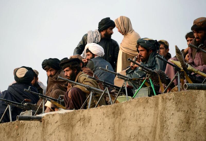 Afghan Taliban fighters listen to an unseen Mullah Mohammad Rasool Akhund, the newly appointed leader of a breakaway faction of the Taliban, at Bakwah in the western province of Farah on November 3, 2015. Javed Tanveer/AFP