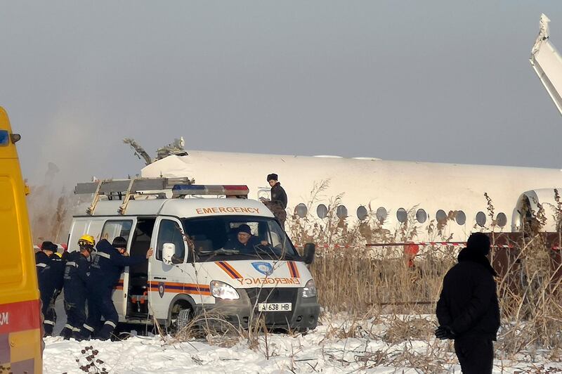 Rescuers work on the sight of a plane crash near Almaty International Airport, outside Almaty, Kazakhstan.  AP