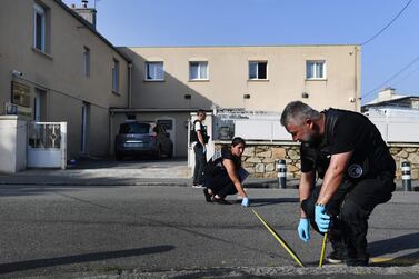 Police officers examine the area outside the Pontanezen Sunna mosque in Brest, western France where the imam and another man were shot on June 27, 2019. AFP