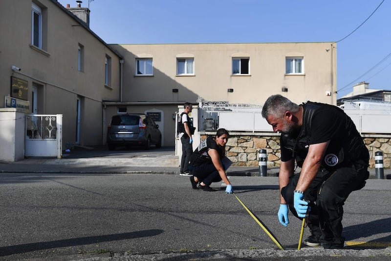 Police officers work at the site of a shooting incident that left two people including an iman injured on June 27, 2019, at the Pontanezen Sunna mosque in Brest, western France. Several shots were fired in the afternoon of June 27 in front of the Brest mosque, injuring two people including Imam Rachid El Jay, according to the French Council of Muslim Faith (CFCM) and other sources. The alleged gunman was found dead, near his car in Guipavas, near Brest, after committing suicide, according to a police source. / AFP / Fred TANNEAU
