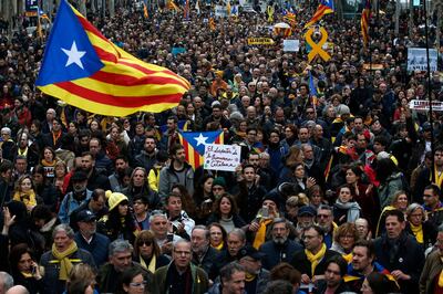 Pro independence demonstrators march during a protest in support of Catalonian politicians who have been jailed on charges of sedition in Barcelona, Spain, Sunday, March 25, 2018. Puigdemont was arrested Sunday by German police on an international warrant as he tried to enter the country from Denmark. (AP Photo/Manu Fernandez)