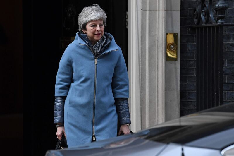 Britain's Prime Minister Theresa May leaves from 10 Downing Street on March 26, 2019. Britain's parliament began plotting a new Brexit strategy today after seizing the initiative in the floundering process from Prime Minister Theresa May's government in a historic vote. / AFP / Paul ELLIS

