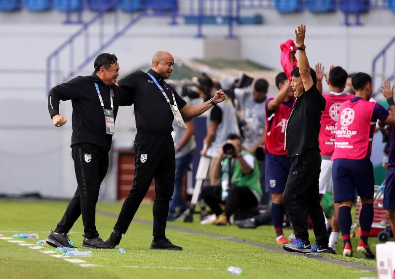 Dubai, United Arab Emirates - January 10, 2019: Thailand interim manager Sirisak Yodyadthai celebrates the win with his coaching staff during the game between Bahrain and Thailand in the Asian Cup 2019. Thursday, January 10th, 2019 at Al Maktoum Stadium, Abu Dhabi. Chris Whiteoak/The National