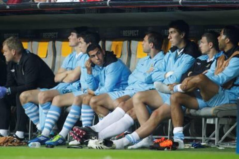 Football - Bayern Munich v Manchester City UEFA Champions League Group Stage Matchday Two Group A - Allianz Arena, Munich, Germany - 27/9/11
Manchester City's Carlos Tevez (4th L) sits on the substitutes bench with team mates during the game
Mandatory Credit: Action Images / John Sibley
Livepic