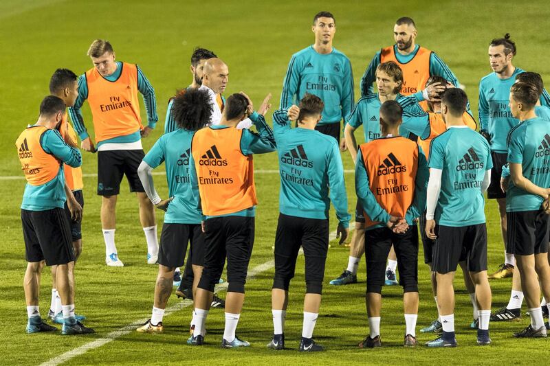 Abu Dhabi, United Arab Emirates, December 11, 2017:    Real Madrid manager Zinedine Zidane speaks with his team during a training session ahead of their FIFA Club World Cup semi-final against Al Jazira at New York University Abu Dhabi on Saadiyat Island in Abu Dhabi on December 11, 2017. Christopher Pike / The National

Reporter: John McAuley
Section: Sport