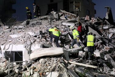 epa08027428 Rescue teams of firemen, army and police search for survivors in the rubble of a collapsed building after an earthquake in Durres, Albania, 26 November 2019. Albania was hit by a 6.4 magnitude earthquake on 26 November 2019, the strongest recorded in decades. According to reports, at least 18 people have died and several are injured in the earthquake. EPA/MALTON DIBRA