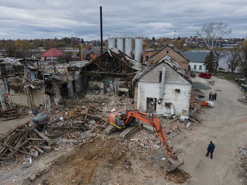 An excavator clears rubble from a bread factory near Kyiv which was bombed by Russian forces. Getty