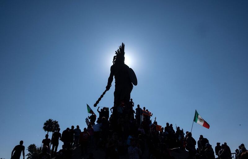 Local residents hold a demonstration against the Central American migrants moving towards the US at Cuauhtemoc statue in Tijuana, Baja California, Mexico. AFP