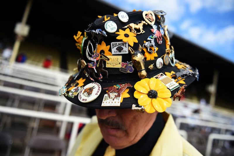 A man wears a decorative hat prior to the 139th running of the Preakness Stakes on Saturday. Patrick Smith / Getty Images / AFP / May 17, 2014
