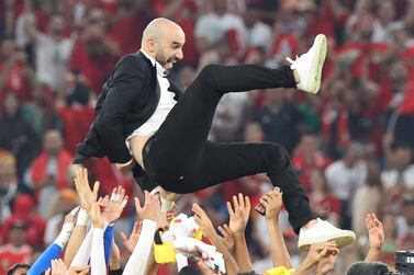 Head coach Walid Regragui of Morocco is tossed in the air after the FIFA World Cup 2022 group F soccer match between Canada and Morocco at Al Thumama Stadium in Doha, Qatar, 01 December 2022.   EPA / Mohamed Messara