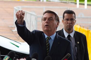 Brazilian President Jair Bolsonaro gestures during a press conference amidst the coronavirus (Covid-19) pandemic at the Palacio do Alvorada March, 25, 2020 in Brasilia, Brazil. Getty