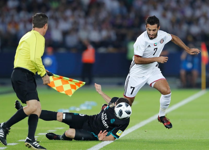 Real Madrid's Nacho, left, challenges for the ball with Al Jazira's Ali Mabkhout. Hassan Ammar / AP Photo