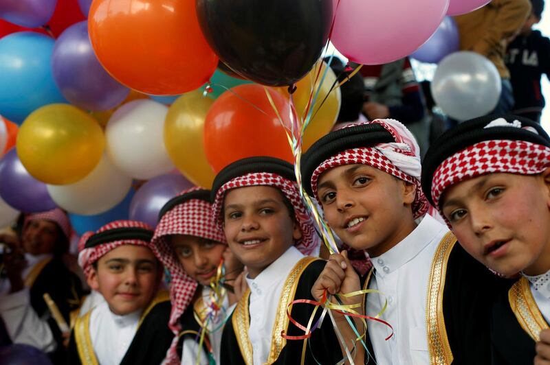 Children dressed in Jordanian traditional costumes celebrate the one millionth visitor for 2019 in the ancient city of Petra. Reuters