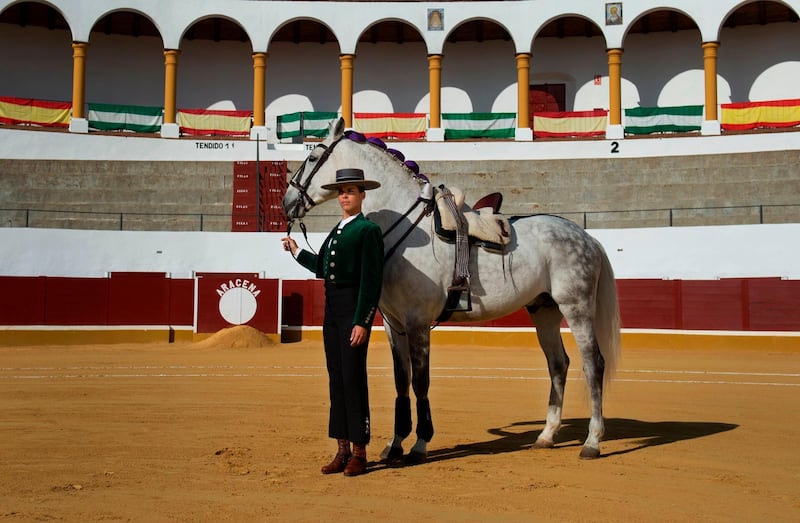 French rejoneadora Lea Vincens, poses at the Aracena bullring, in Huelva, southern Spain. Cristina Quicler / AFP Photo