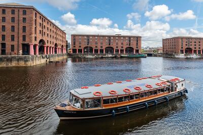 A boat makes its way through Albert Dock. Darren Robinson for The National