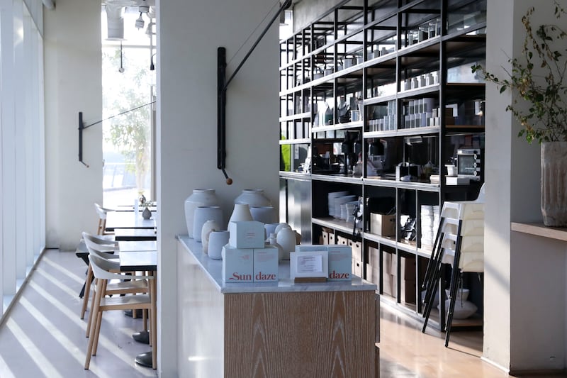 The interiors of No Fifty Seven Boutique Cafe are sleek and minimal. Khushnum Bhandari / The National