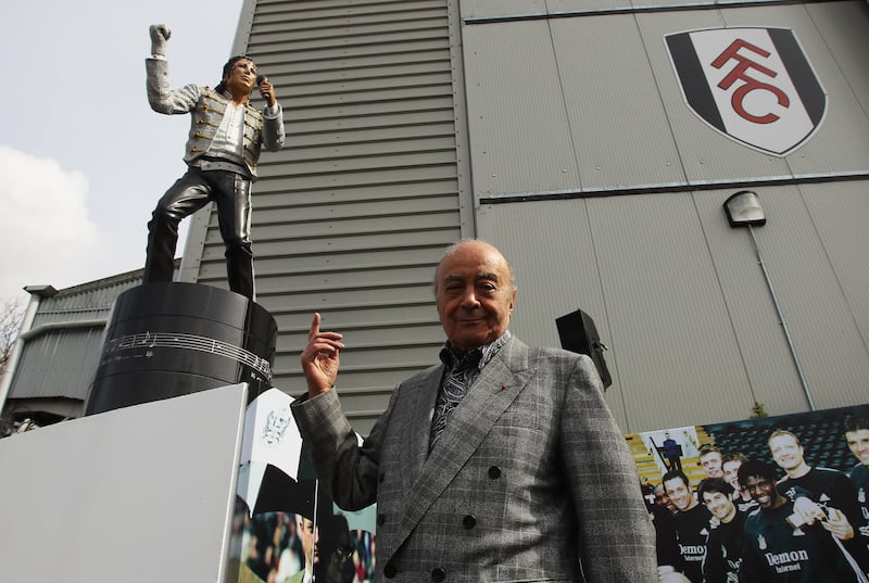 Mohamed Al Fayed unveils a statue in tribute to Michael Jackson at Fulham FC's Craven Cottage stadium in 2011.