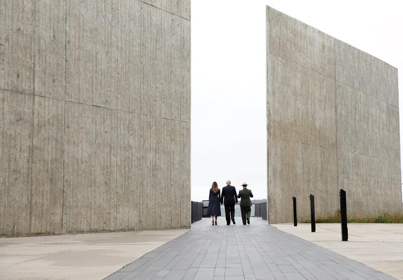 Trump and Melania walk with park superintendent Stephen Clark at the Flight 93 National Memorial. Reuters