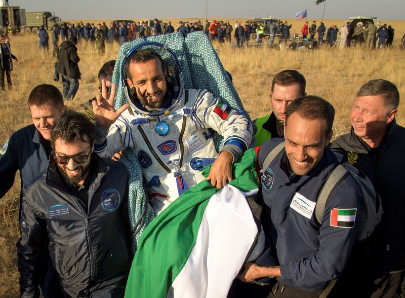 In this image released by NASA, Russian space agency rescue team members and United Arab Emirates (UAE) specialists carry UAE astronaut Hazzaa al-Mansoori shortly after the landing of the Russian Soyuz MS-12 space capsule about 150kms (90 miles) southeast of the Kazakh town of Dzhezkazgan on October 3, 2019.  A three-man crew including an Emirati who became the first Arab to reach the International Space Station returned to Earth safely on Thursday and were in good shape, the Russian space agency Roscosmos said.
 - RESTRICTED TO EDITORIAL USE - MANDATORY CREDIT "AFP PHOTO / NASA / Bill INGALLS" - NO MARKETING NO ADVERTISING CAMPAIGNS - DISTRIBUTED AS A SERVICE TO CLIENTS
 / AFP / NASA / Bill INGALLS / RESTRICTED TO EDITORIAL USE - MANDATORY CREDIT "AFP PHOTO / NASA / Bill INGALLS" - NO MARKETING NO ADVERTISING CAMPAIGNS - DISTRIBUTED AS A SERVICE TO CLIENTS
