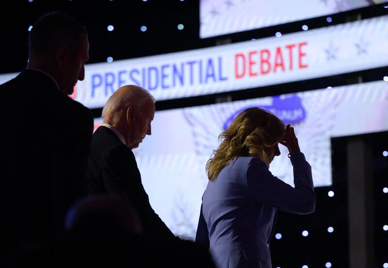 US President Joe Biden walks off the debate stage with his wife, Jill Biden, in Atlanta on Thursday. Reuters