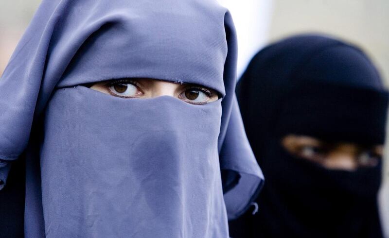 Unidentified women are seen wearing a niqab during a demonstration outside the Dutch parliament in The Hague, Netherlands.  AP Photo / Fred Ernst, File