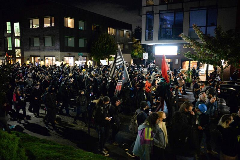 Black Lives Matter protesters march through the streets of Southeast Portland, Oregon. President Donald Trump and Democratic challenger Joe Biden are battling it out for the White House, with polls closed across the United States Tuesday -- and a long night of waiting for results in key battlegrounds on the cards. AFP