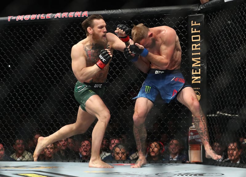 January 18, 2020; Las Vegas, Nevada, USA; Conor McGregor moves in for a hit against Donald Cerrone during UFC 246 at T-Mobile Arena. Mandatory Credit: Mark J. Rebilas-USA TODAY Sports