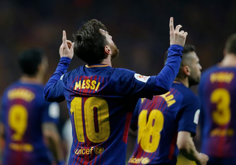 Lionel Messi celebrates after scoring Barcelona's second goal against Sevilla during their Copa del Rey final at the Wanda Metropolitano stadium in Madrid. Francisco Seco / AP Photo