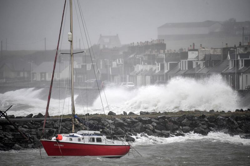 PORT WILLIAM,  - FEBRUARY 15: Waves crash against the harbour wall on February 15, 2020 in Port William, United Kingdom. The Met Office has issued an amber alert for rain in parts of Dumfries and Galloway including the Borders and a yellow weather warning for wind for large parts of the UK as storm Dennis passes over the UK. Last week two people were killed as storm Ciara saw parts of the country hit by 93mph winds. (Photo by Jeff J Mitchell/Getty Images)