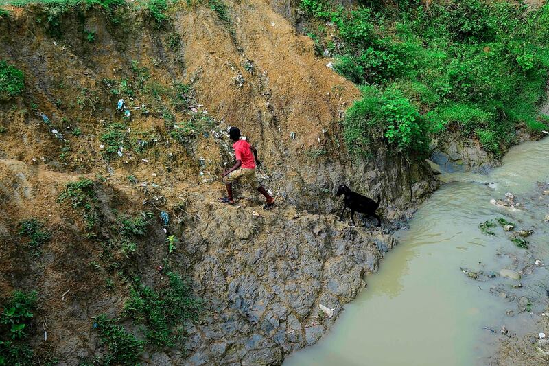 A boy pulls his goat at a camp in Teknaf. AFP