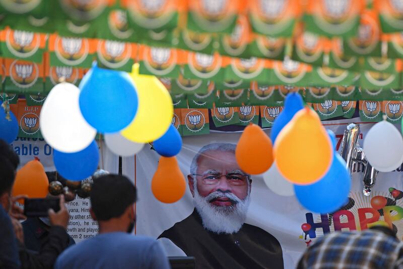 Bharatiya Janata Party workers gather to celebrate the 71st birthday of India's Prime Minister Narendra Modi at party headquarters in Srinagar. AFP