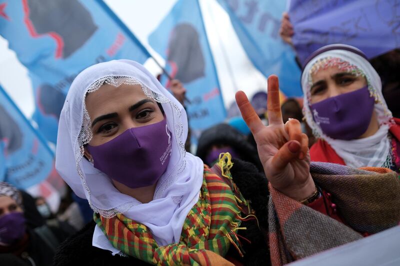 A demonstrator wearing a face mask to prevent the spread of the coronavirus disease (COVID-19) flashes the V sign during a rally ahead of the International Women's Day in Istanbul, Turkey March 6, 2021. REUTERS/Murad Sezer