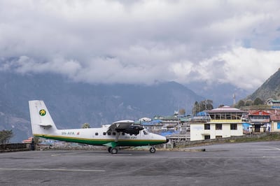 A small propller aircraft belonging to Tara Air on The runway at Tenzing Hillary Airport, Lukla, Nepal. (Photo by: Loop Images/UIG via Getty Images)