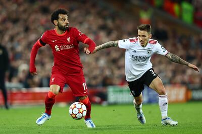 Alex Grimaldo of Benfica, right, in action against Liverpool's Mohamed Salah. Getty