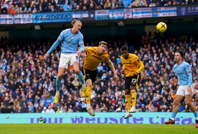 Erling Haaland heads home Manchester City's first goal. PA