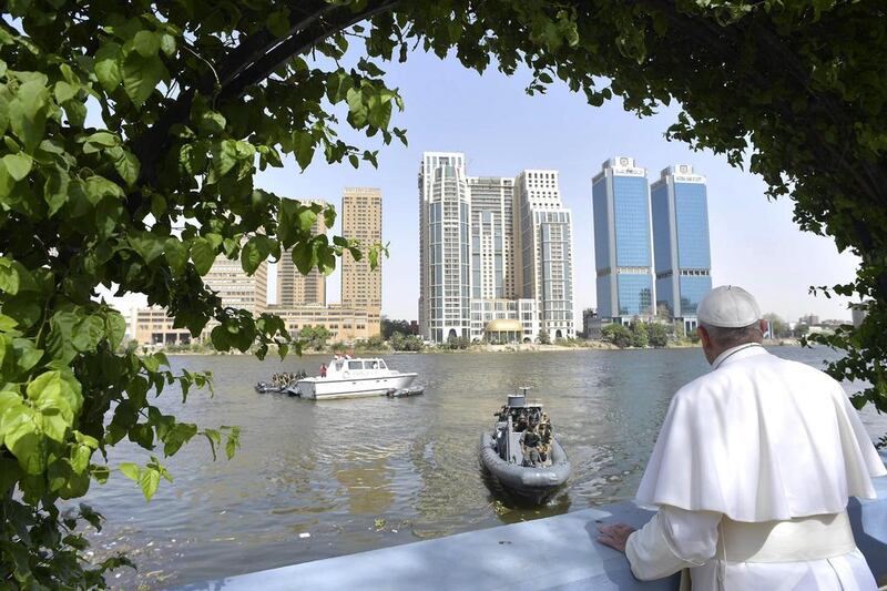 Pope Francis looks over the river Nile from a terrace, during a meeting with the clergy and religious, in Cairo, Egypt. AP Photo