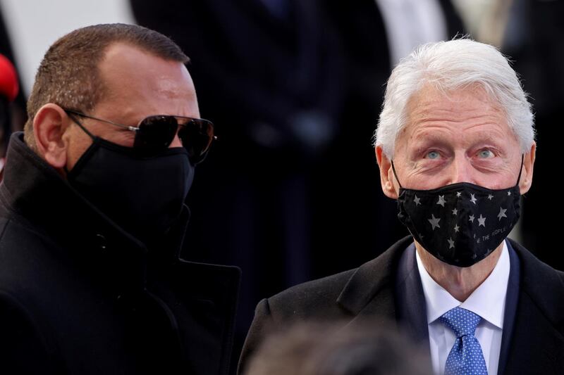 Former US president Bill Clinton and former baseball player Alexander Rodriguez are pictured before the inauguration of Joe Biden. Reuters