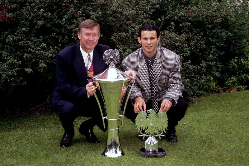 Manchester United manager Alex Ferguson shows off his Manager of the Year trophy alongside Ryan Giggs, recipient of the Young Eagle of the Year.