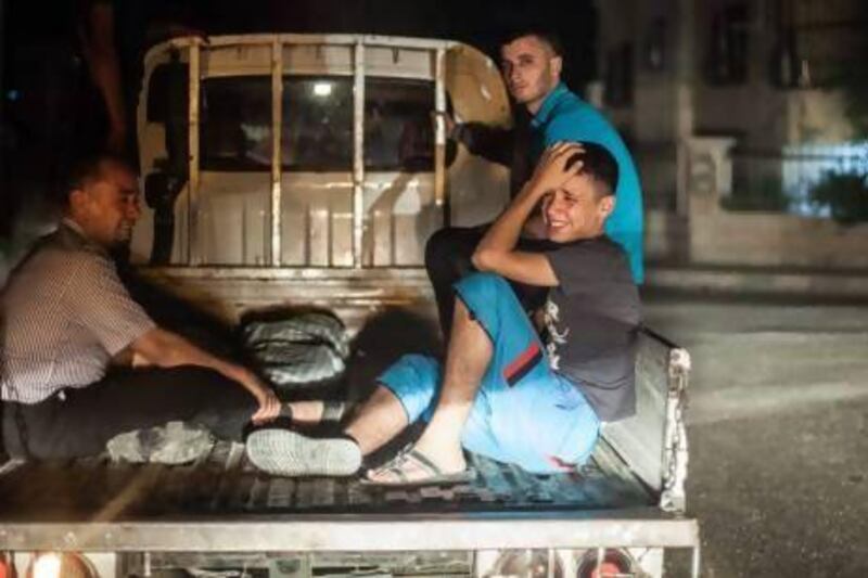 A Syrian man mourns the deaths of six of his siblings who were killed in a bomb attack during fighting between rebels and Syrian government forces in the northern city of Raqqa.