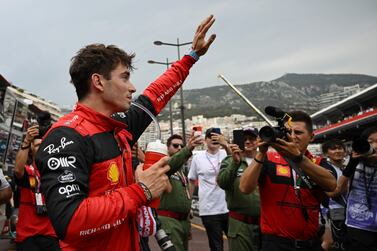 Ferrari driver Charles Leclerc of Monaco celebrates after setting the pole position in the qualifying session at the Monaco racetrack, in Monaco, Saturday, May 28, 2022.  The Formula one race will be held on Sunday.  (Pool Photo / Christian Bruna / Via AP)