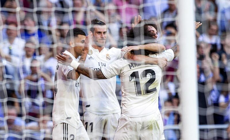 Real Madrid's Gareth Bale, second left, celebrates with his teammates. EPA
