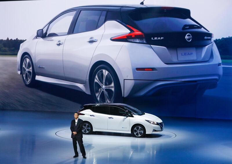 epa06186843 Nissan Motor Corp. President and Chief Executive Officer (CEO) Hiroto Saikawa unveils the company's new electric vehicle, called 'LEAF', during the world premiere at Makuhari Messe in Chiba, east of of Tokyo, Japan, 06 September 2017. The vehicle will be available for sale in Japan on 02 October 2017.  EPA/KIMIMASA MAYAMA