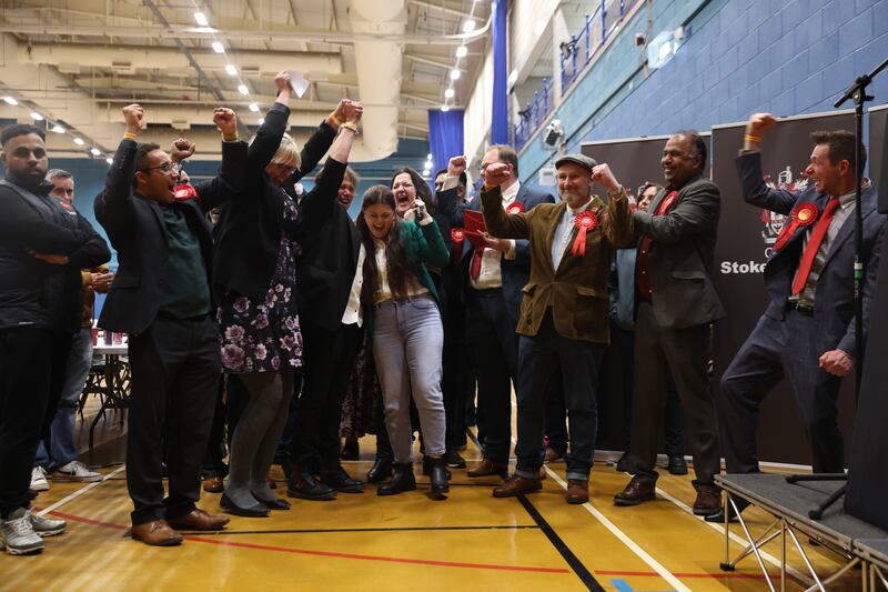 Labour Party members celebrate after Susan Akkurt wins a seat on Stoke On Trent council. Labour took control of Stoke on a bad night for the ruling Conservatives in England's local council elections. Getty 