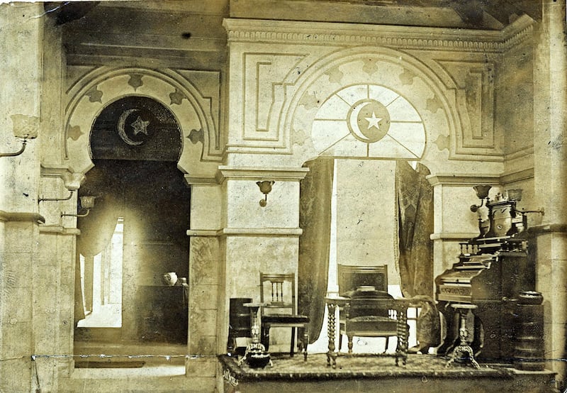 A Victorian photograph of the original interior of the Abdullah Quilliam Mosque. Arches and the crescent can be seen, while a piano is on an elevated platform, symbolising a 'transition from Christianity to Islam'. Credit: Abdullah Quilliam Society